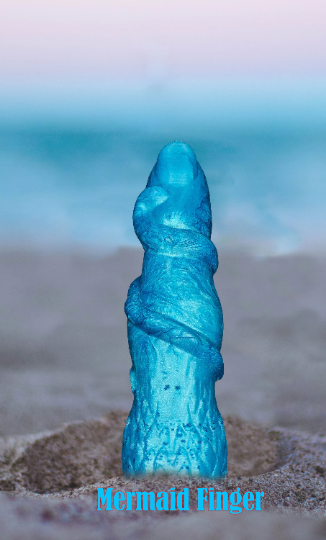 Blue Mermaid Finger fantasy toy standing in sand